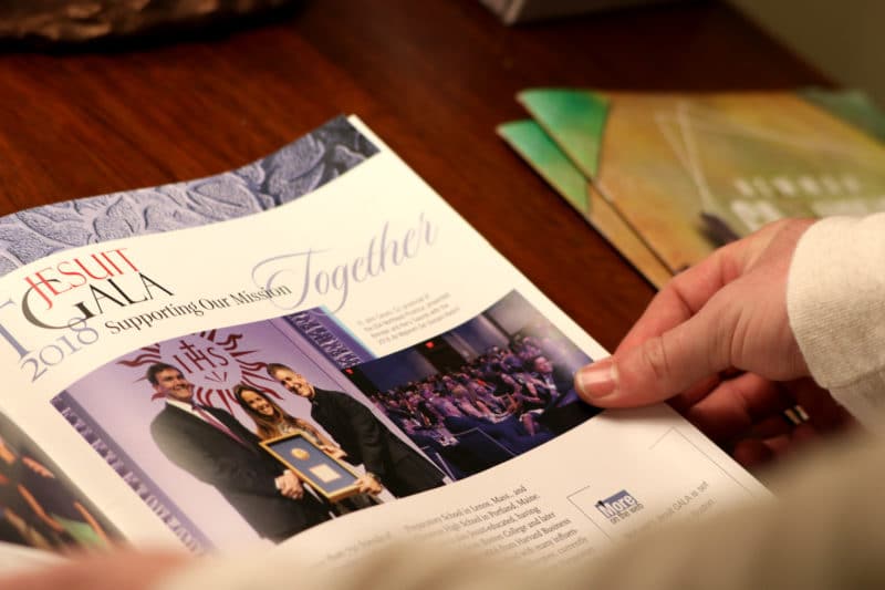 CLIFTON, NJ 10/30/18 DAN ROBINSON READS ARTICLE ABOUT JESUIT GALA MISSION:
Newman Catholic Missionary Dan Robinson reads article about a Jesuit missions gala. The mission is for people to join together to serve a mission of hope.
-Photo by Katherine Braunstein